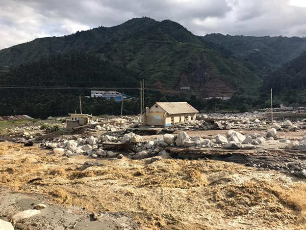 Flood aftermath in Kasese showing damage to buildings and infrastructure